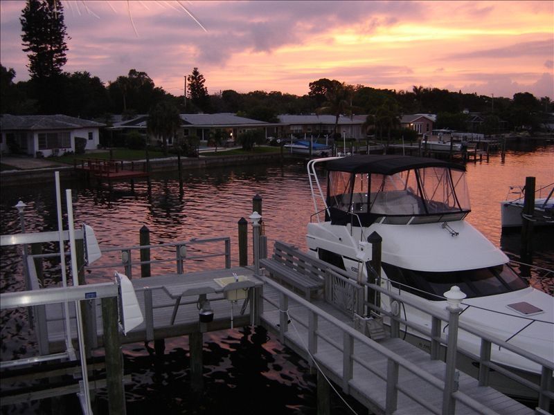 https://stpetehouserental.com/wp-content/uploads/2016/09/View-of-our-dock-at-sunset-which-we-have-year-around.jpg